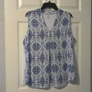 Lovely and flowing blue and white print blouse.